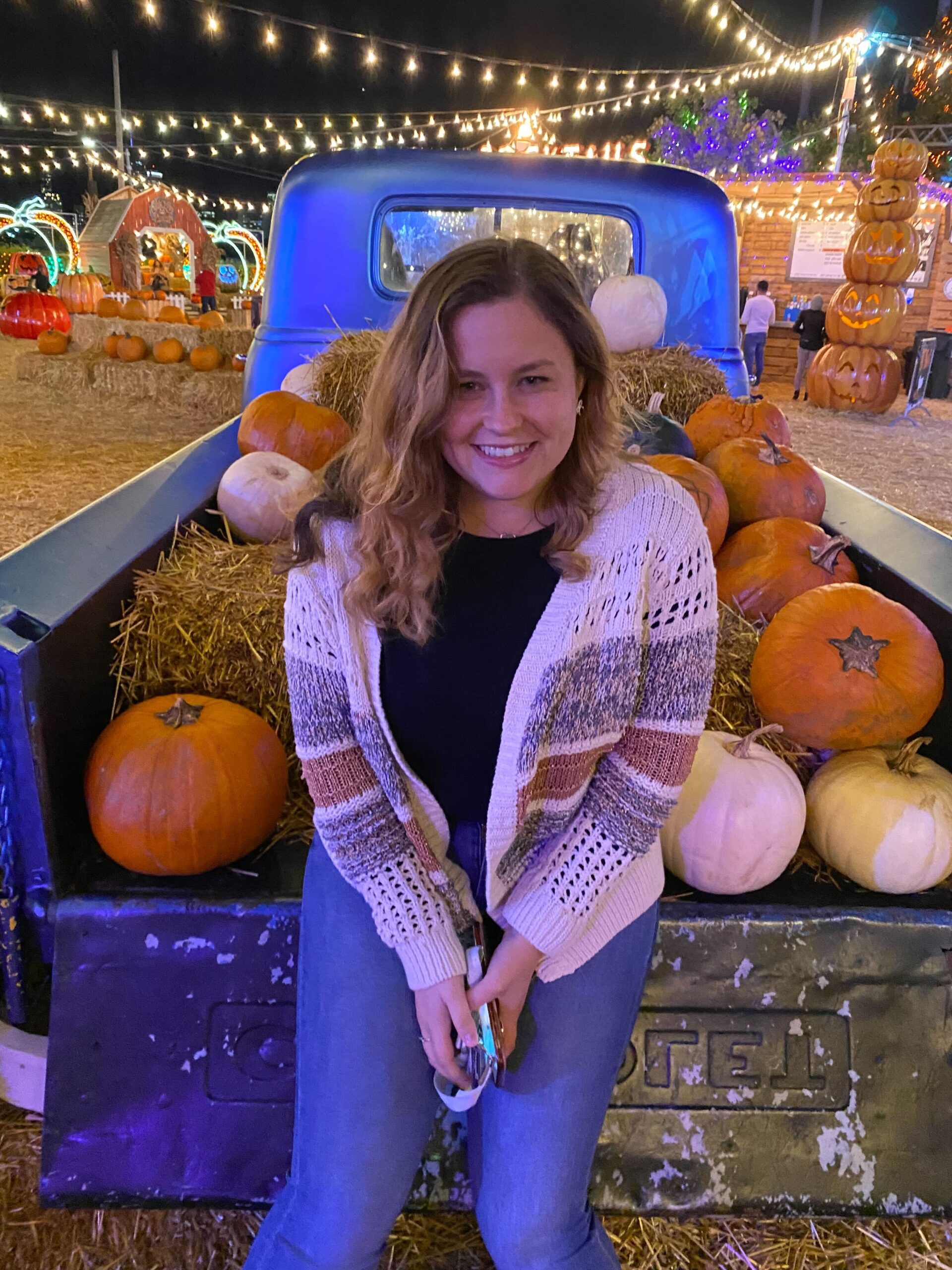Elisabeth with pumpkins at fall festival